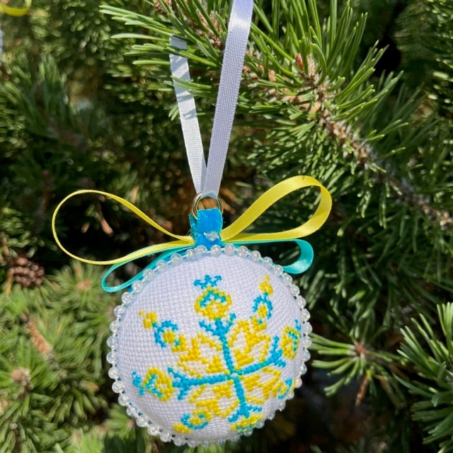 Seasonal cross-stitch ornaments in blue and yellow for a unique Christmas gift | Gift-Emporium