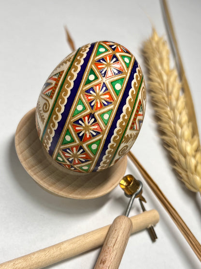 Close-up of hand-painted Pysanka egg art on brown shell | Gift-Emporium
