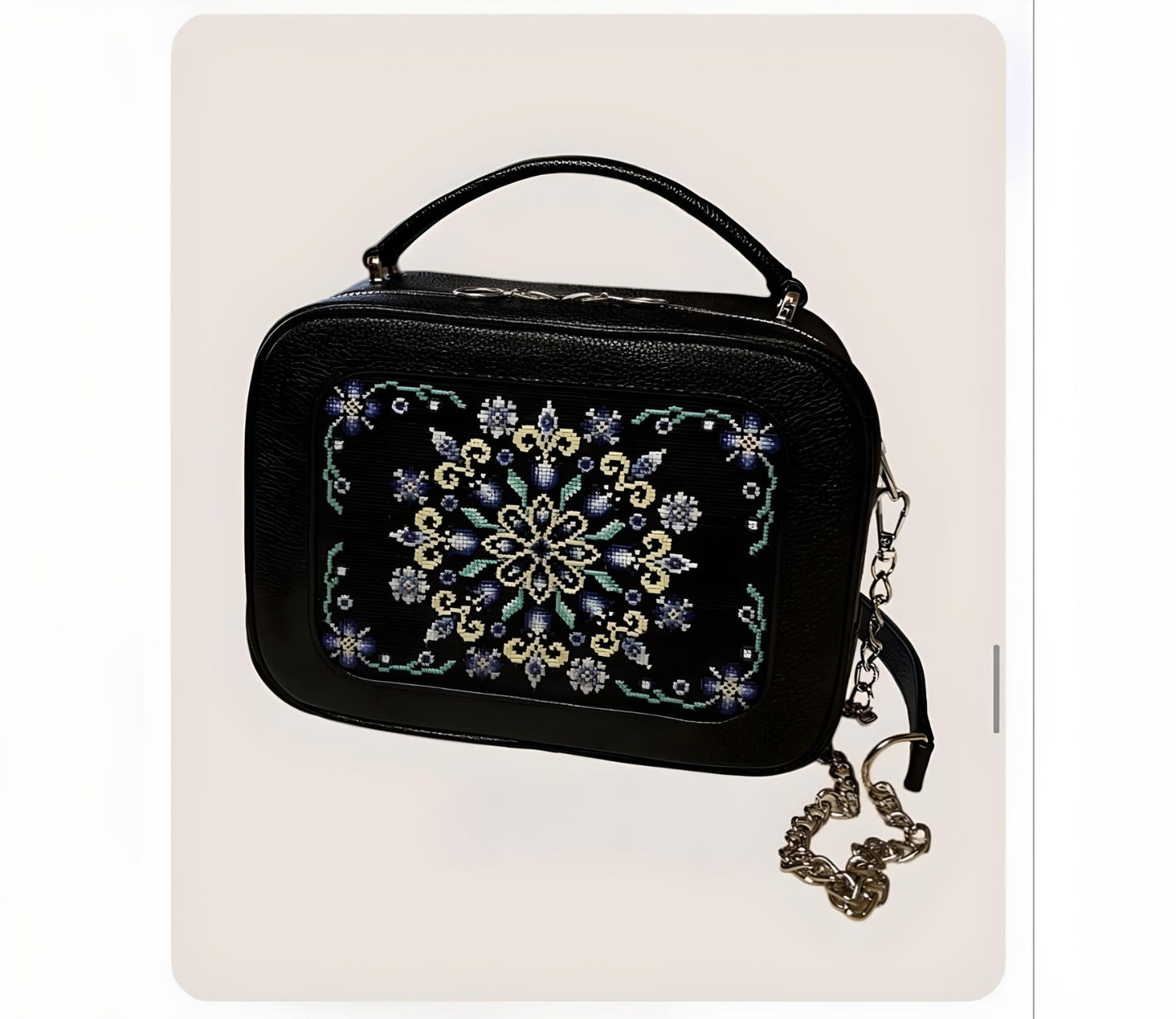 Artisan-crafted black leather cross stitch bag showcasing unique patterns | Gift-Emporium