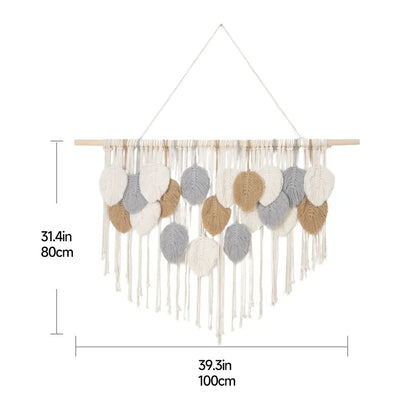 Intricate leaf tapestry wall decor with fringed tassels, neutral tones