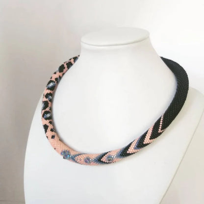 Colorful beaded necklace in pink and grey tones made from Japanese beads, suitable for special occasions.