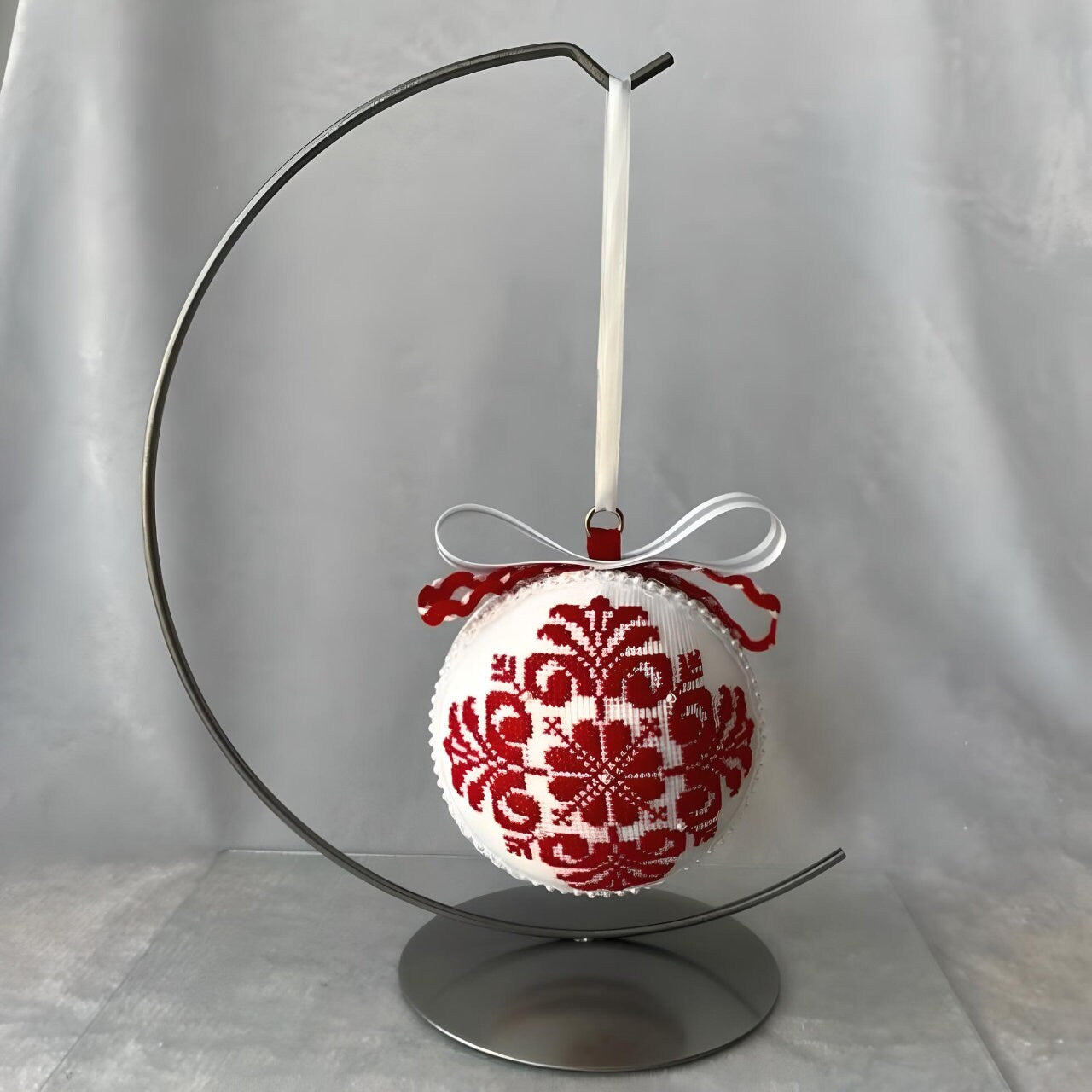 Handcrafted red velvet tree ball with intricate cross-stitch pattern | Gift-Emporium