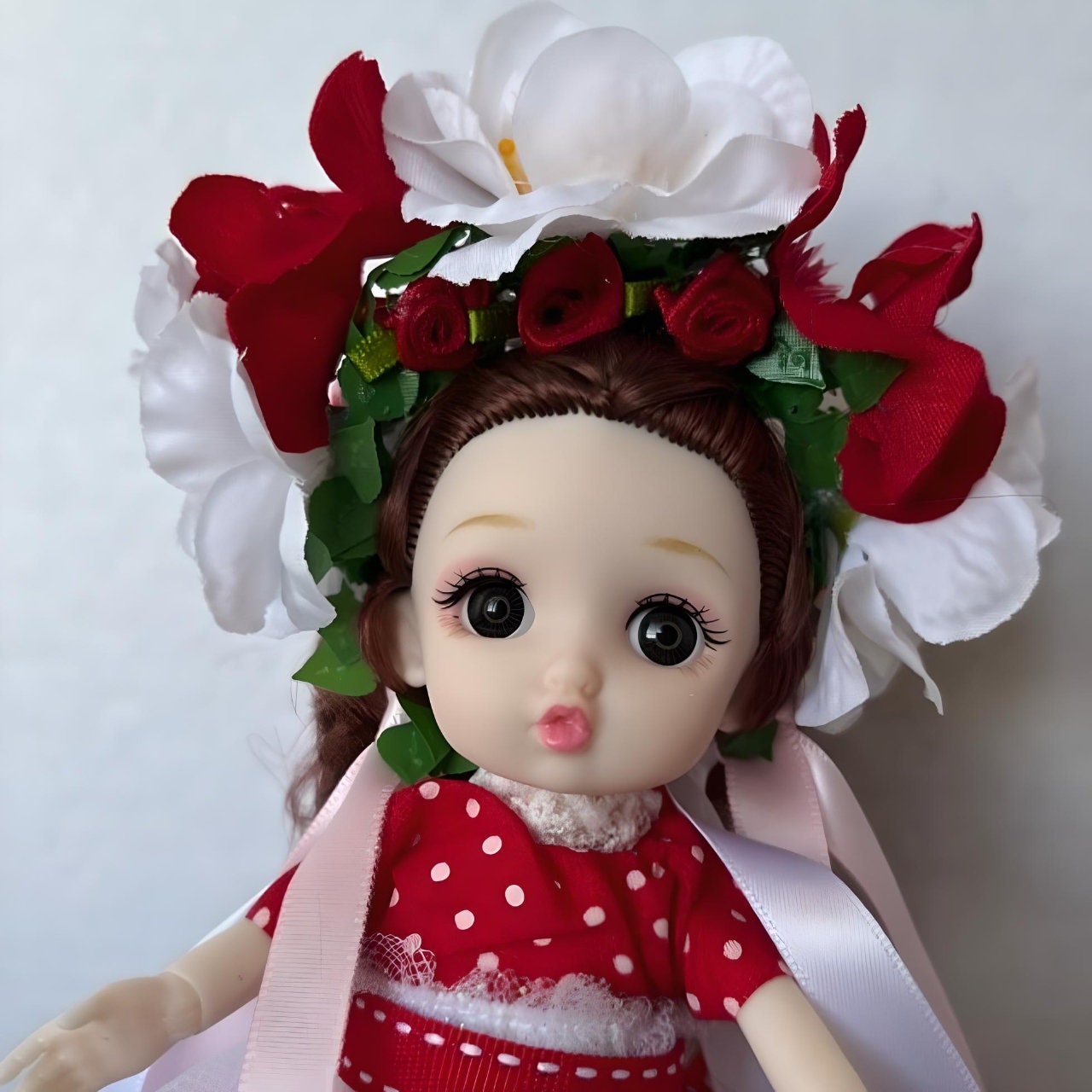 Miniature Ukrainian doll wearing a red and white outfit and floral headpiece | Gift-Emporium