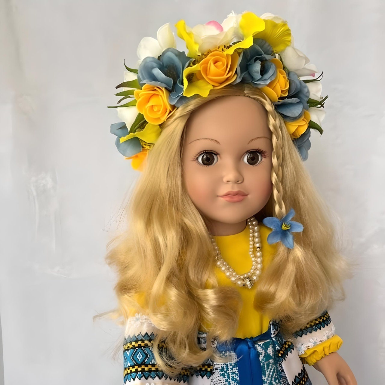 Ukrainian collectible doll wearing a blue and yellow hand-stitched outfit | Gift-Emporium