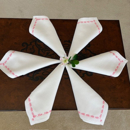 Handmade white napkins with deep rose rose embroidery for elegant dinner setting | Gift-Emporium